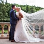 Bride and groom on front steps of Marden Park mansion, Wedding Venue in Surrey