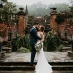 Bride and groom by coy carp pond at Marden Park mansion, Wedding Venue in Surrey