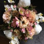 Wedding bouquet in warm peach shades