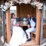 a happy couple sat togther at the moat