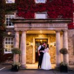 Bride and Groom at the Front of the Hotel