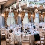 Ballroom wedding set up with dressed ceiling