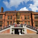 Wedding party on front steps of mansion at Marden Park, Surrey wedding venue